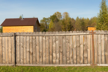 fence from boards in the village