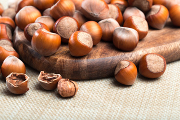 close up of hazelnuts on table .