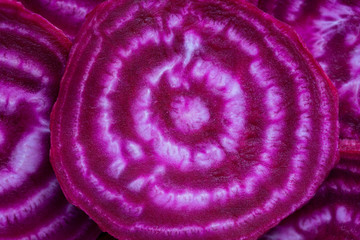 Red beetroot slice closeup. Purple beet cut in half with the texture of pulp. Beetroot slices...
