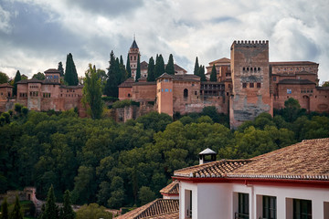 Fototapeta na wymiar Alhambra Palace in Granada , Spain Full view at sun set time. Sierra Nevada is the backgorund. Albaicin is in front of this monument.