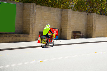 Fototapeta na wymiar Postman on a Bicycle - Perth - Australia