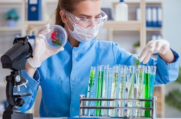 Female scientist researcher conducting an experiment in a labora