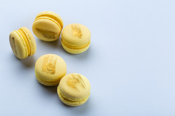 Yellow macaroons on blue background