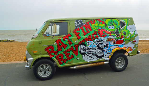  Classic Customised Ford Econoline 100 Van parked on seafront promenade.