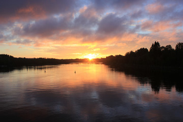 Fototapeta na wymiar Sunset background of the lake