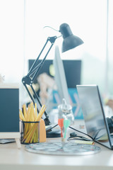 Office table business professional creative. Room office desk for hipster with camera, Laptop and computer. Corporate organization workplace.