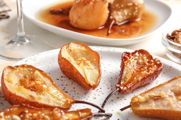 Tasty cooked pears on plate, closeup