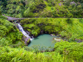 Fototapeta na wymiar Maui, Hawaii Hana Highway - Wailua Iki Falls (Wailuaiki). Road to Hana connects Kahului to the town of Hana Over 59 bridges, 620 curves, tropical rainforest