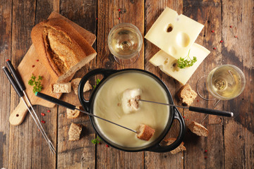 cheese fondue with wine and bread, top view