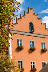 Orange stepped gable house with geraniums.  Vipiteno (or Sterzing), Italy 