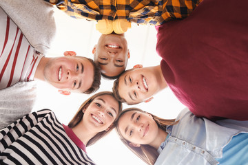 Portrait of teenagers on white background, bottom view