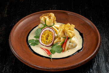 Pancakes stuffed with soyce and hot pepper. With delicious granadilla.