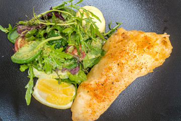 fried fish with salad