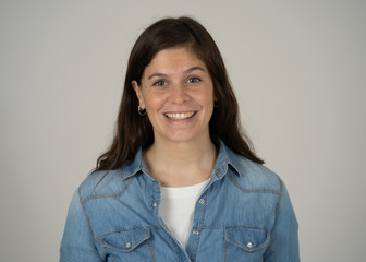 Fototapeta premium Portrait of young attractive cheerful woman with smiling happy face. Human expressions and emotions