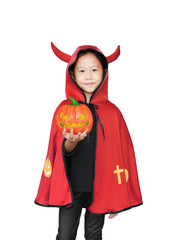 Beautiful little Asian child girl dressed Halloween costume with holding magic pumpkin in hand. Kid in Dracula robe isolated on white background.