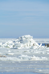 Winter landscape. Pile of ice on a frozen sea.