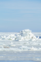 Winter landscape. Pile of ice on a frozen sea.