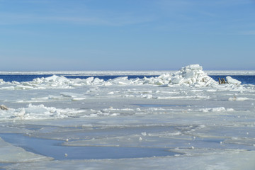 Winter landscape. Pile of ice on a frozen sea.