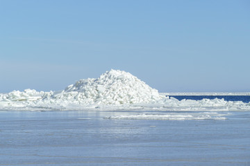 Winter landscape. Pile of ice on a frozen sea.