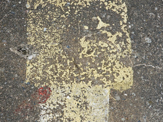 faded paint on a concrete plate