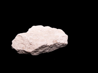 Zeolite natural raw stones on black background. Macro shot