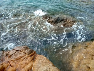 waves crashing on rocks