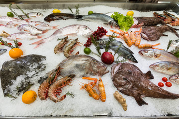A beautiful composition of fish and fresh seafood with lemon on ice