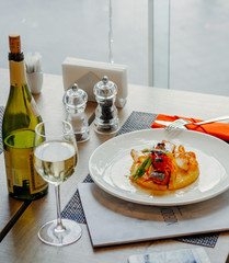 grilled salmon on mashed potato puree with boiled vegetables, white wine for lunch