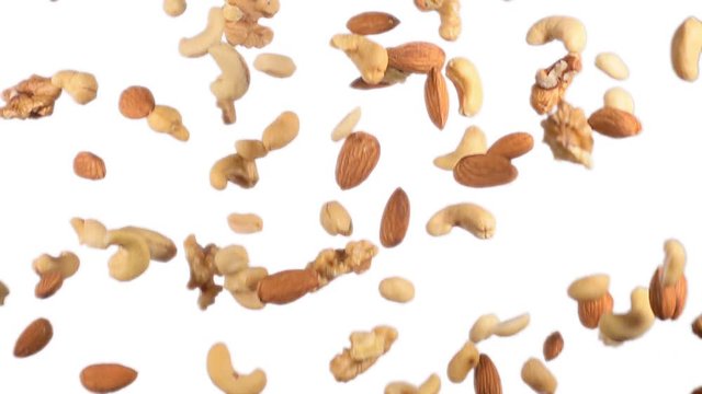 heap of dried fruit flying in super slow motion on white background