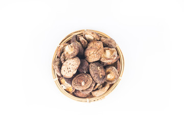 Dried shiitake mushrooms on a white background