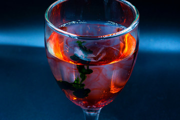Abstract ink drop to water in glass wine 