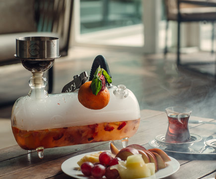 mini glass hookah shisha with strawberry and orange flavour at tea setup