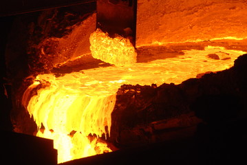 Very rare close view of working open hearth furnace at the metallurgical plant. Molten hot steel