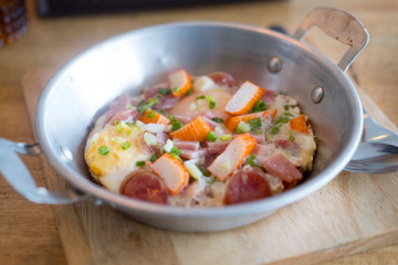 Pan fried egg with toppings in Thai style for breakfast