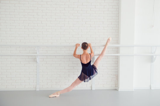 ballerina doing stretching in choreography class