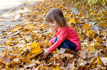 little girl in autumn park, kids active games, place for text