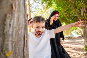 Arabic mother get angry with her son cause s he covered him self with chocolate