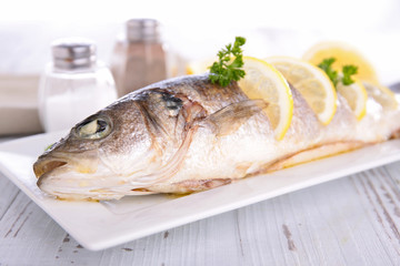grilled fish and lemon- studio shot