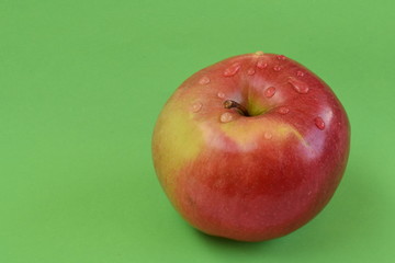 Apple isolated on green background