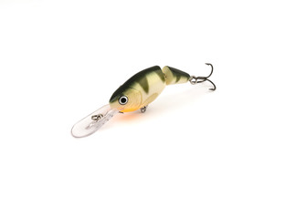 Fish bait in the form of fish with a hook on a white background.