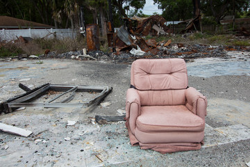 Illegally discarded and dumped trash with a pink chair