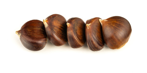 Chestnuts with shell isolated on white background, a pile of fresh chestnuts