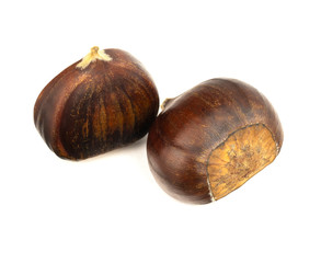 Two brown chestnuts isolated on white background