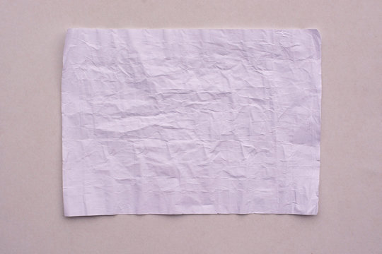 Crumpled sheet of white paper close-up.