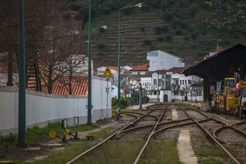 General view at the train station on Pinhao city with different lines, vineyards on background