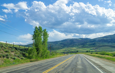 Freeway in the countryside and mountains. Rocky Mountains National Park, USA