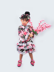 asian little girl  Wearing yukata Holding flowers on white backgound