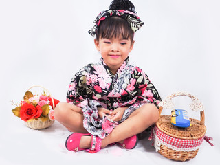 asian little girl  Wearing yukata with fruit basket on white backgound
