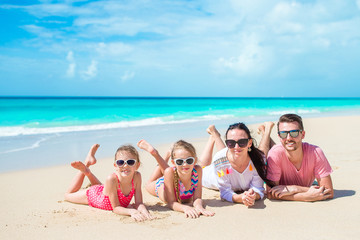 Happy family on the beach during summer vacation