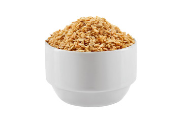 Chopped garlic in a bowl isolated on white background with copy space for text or images. Spices and herbs. Packaging concept. Close-up.